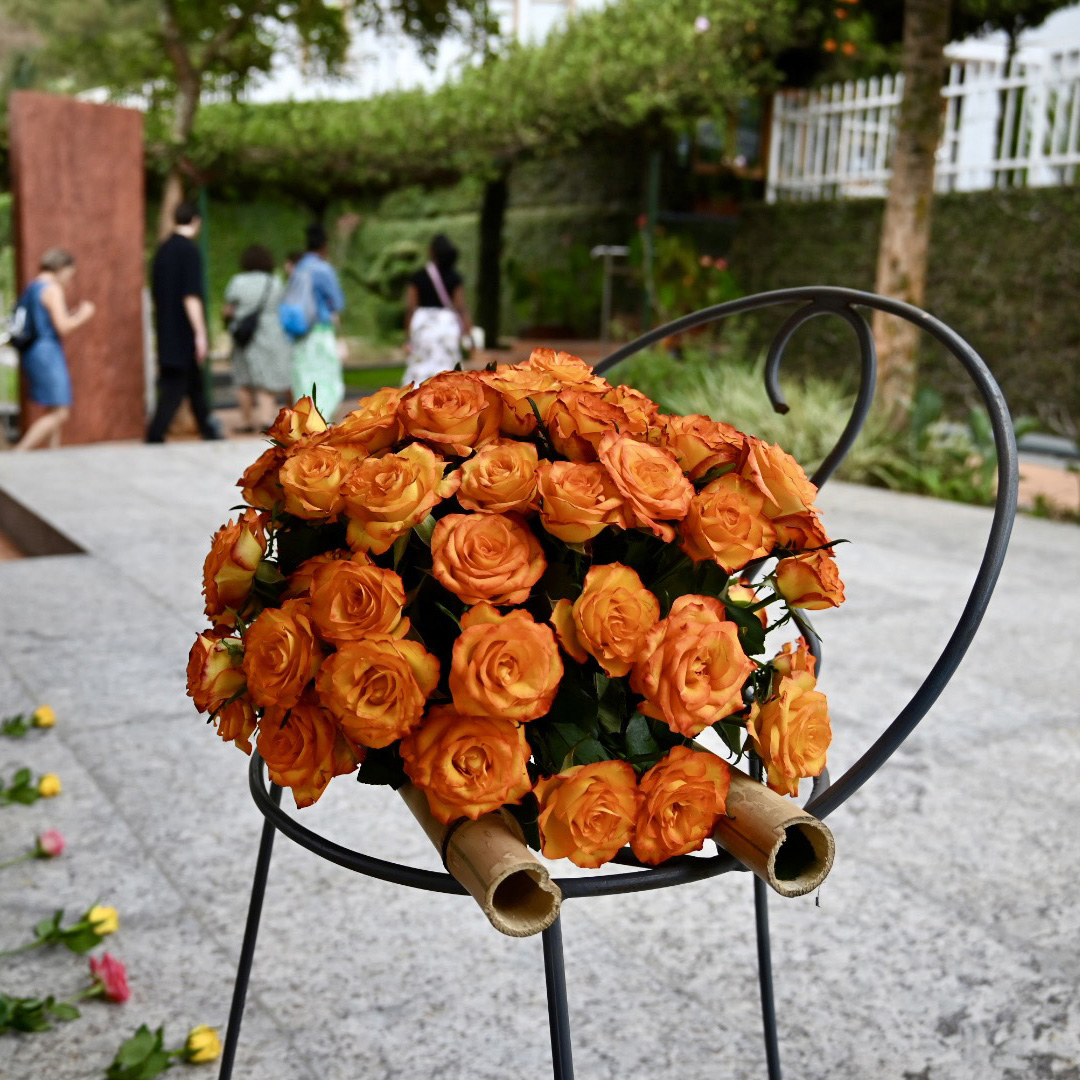 Students laid a wreath of roses on the site of a mass grave at Kigali Genocide Memorial.